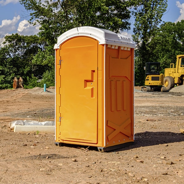 what is the cost difference between standard and deluxe portable restroom rentals in Exira IA